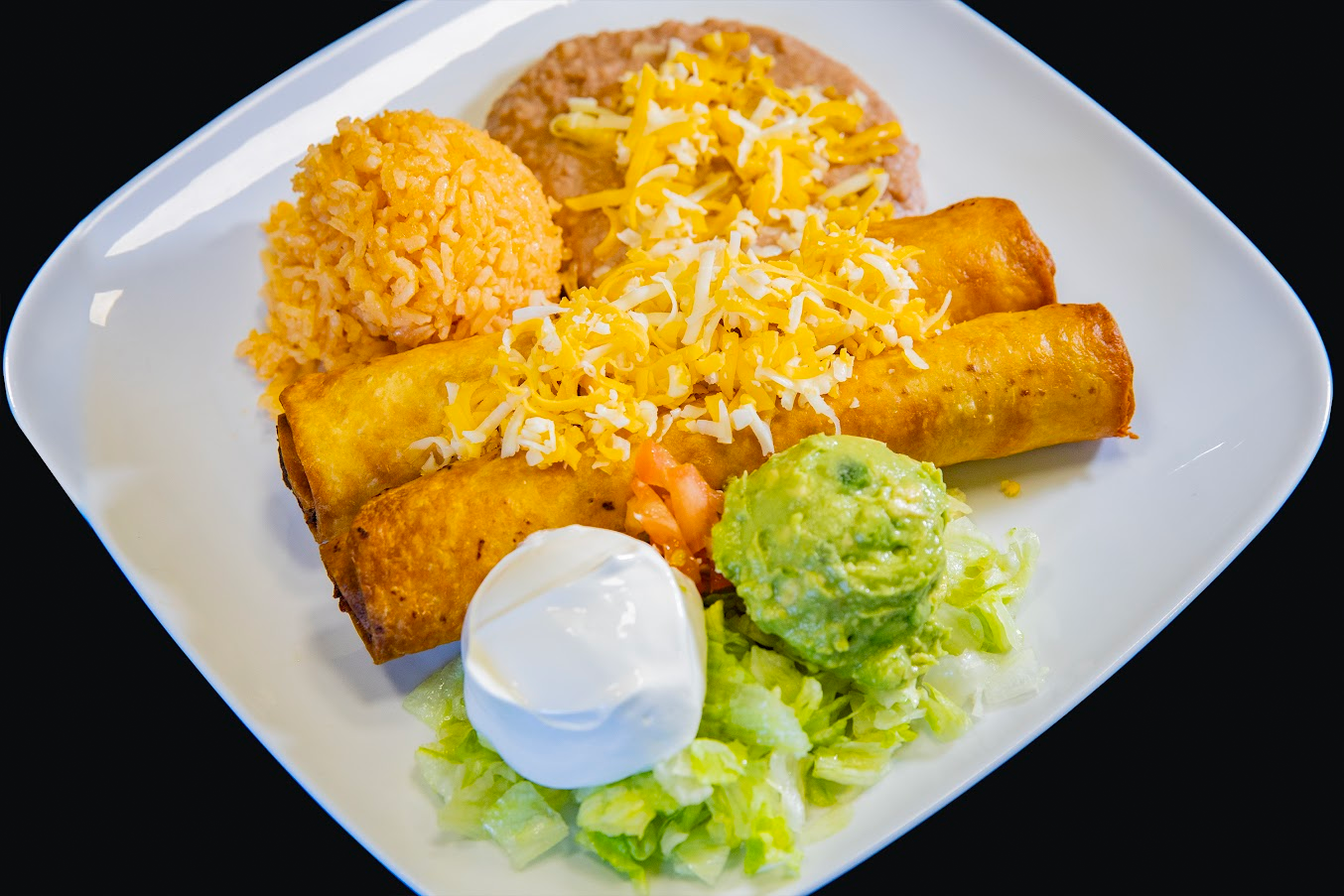 Flautas plate with guacamole and sour cream